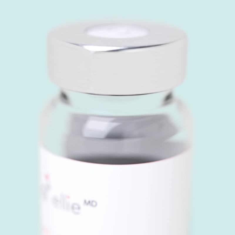 White container with a silver lid on a light blue background